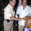 Winston Sill / Freelance Photographer
Douglas Vaz (left) and Joseph Adduci (centre); are fascinated by Health  Minister Rudyard Spencer's new do. He is the latest in a number of men of senior years to sport the sexy look!
They were at the Guardsman Group Limited's Christmas party, at Old Hope Road on Friday.

******************************************************************************************** December 11, 2009. Here are Douglas Vaz (left); the cigarman???? (centre); and Minister Rudyard Spencer (right).