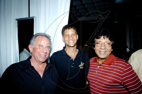 Winston Sill / Freelance Photographer
Robert Epstein (let); Nicholas Benjamin (centre); and his dad Kenny, say 'cheese' at Friday's Guardsman Group Limited's Christmas Party, at  the company's Old Hope Road headquarters.

****************************************************************************yon Friday December 11, 2009. Here are Robert Epstein (let); Nicholas Benjamin (centre); and Kenny Benjamin (right).