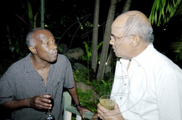 Winston Sill / Freelance Photographer
Attorney Harold Brady (left) and West Indies cricket legend Jeff Dujon hobnob at the Guardsman Group Limited Christmas party.

**************************************************************, held at their Head Office, Old Hope Road on Friday December 11, 2009.