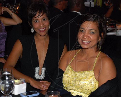Colin Hamilton/Freelance Photographer PSOJ Hall of Fame on December 7, 2010 - At left, Nasma Mohammed and Denise Williams (PR Manager - Flow)