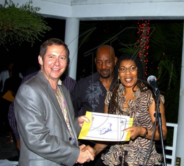 Winston Sill / Freelance Photographer
Beverley Needham, CEO of the Bustamante Hospital for Children hands a certificate of appreciation to Bruce Bowen, CEO of Scotiabank while Health Minister Ruddy Spencer looks on.



host Thank You Reception for Shaggy Foundation and Sponsors of the Shaggy and Friends Concert, held at Bracknell Avenue, Jack's Hill on Monday night January 4, 2010.