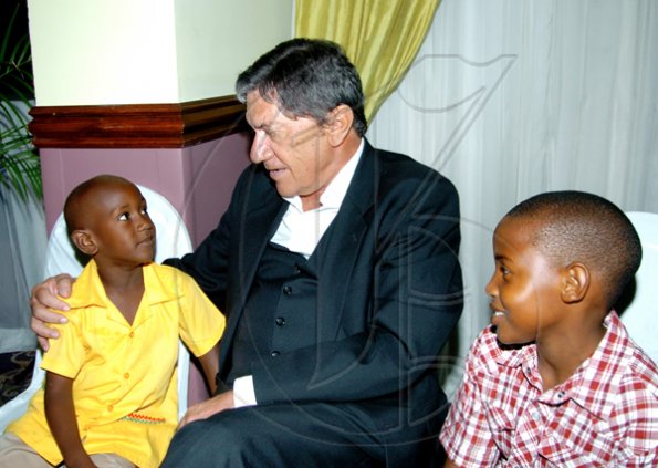 Winston Sill / Freelance Photographer
The man of the moment, Frank Rosheuvel (centre) loves children (remember the hotel's KIDS Charity initiative) so it was no surprise we caught him lyming with Orlando Hewitt (left) and Angel Johnson at his farewell.



Hilton Kingston Hotel host Farewell Reception, held at Hilton Hotel, New Kingston on Tuesday night June 29, 2010.  (right).