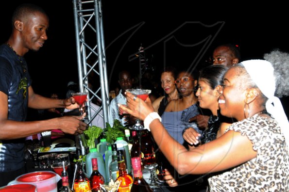Winston Sill / Freelance Photographer
Appleton Estate Jamaica Rum International Bartender Showcase 2010, held at in the Sunken Garden at Hope Gardens, Old Hope Road on Friday night October 22, 2010. Here is St. Aublyn Kidd (left) of Jamaica; and Claudette Powell (right).