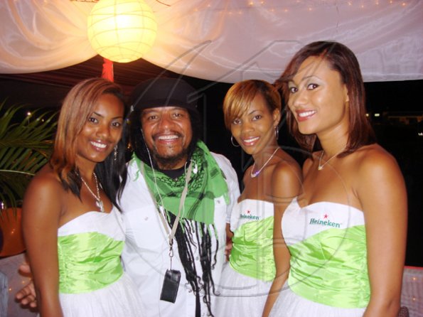 Contributed
International recording artiste Maxi Priest hangs out with the Heineken girls (from left), Tirzah Mahabeer, Pamela Francis and Trizan Chung Ling.

******************************************************* at the Jamaica Jazz and Blues Festival on Thursday January 28 at the Trelawny Multi Purpose Stadium.