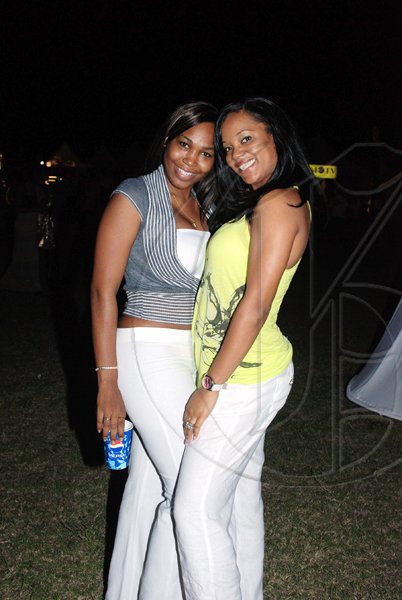 Glennette Campbell (left) and Terry-Ann Ho-Sang pose for the camera at the Jamaica Jazz and Blues Festival on Thursday night at the Trelawny Multi-purpose Stadium.