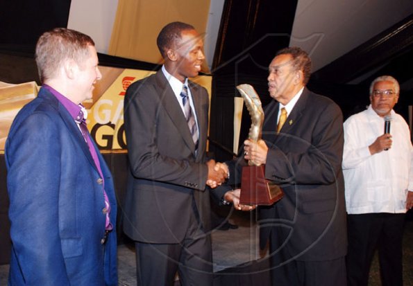 Colin Hamilton/Freelance Photogapher
It was no surprise as Hon Usain Bolt (centre), world's fastest man walked away with the Golden Cleat Awards for Male Athlete of the Year. The award is  presented by Howard Aris (right) while Bruce Bowen, Scotiabank head,  looks on. 
***************************************************************************************************** 


JAAA Awards at Jamaica House on Saturday January 8, 2010.