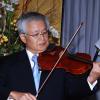 Colin Hamilton/Freelance Photographer
Ambassador?Hiroshi Yamaguchi playing the National Anthem during the Embassy of Japan hosted a reception in honour of the 76th birthday and 20th year of the reign of the Emperor Akhito at the Pegasus Hotel on December 9, 2009.