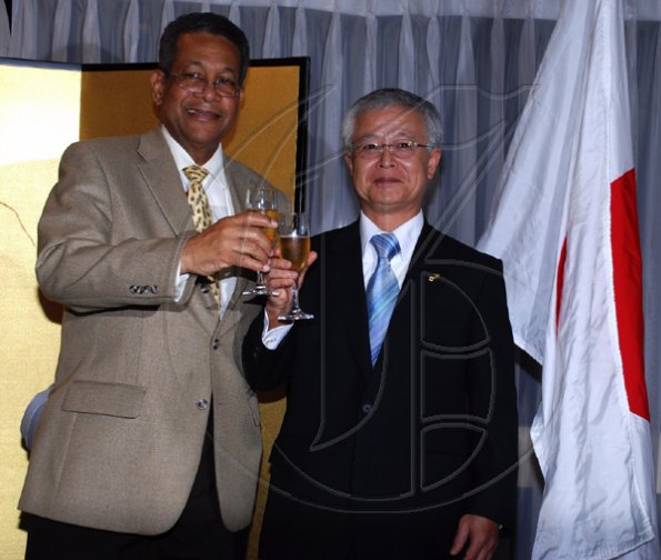 Colin Hamilton/Freelance Photographer
Foreign Affairs Minister Dr. Ken Baugh toasts with Ambassador?Hiroshi Yamaguchi during the Embassy of Japan hosted a reception in honour of the 76th birthday and 20th year of the reign of the Emperor Akhito at the Pegasus Hotel on December 9, 2009.