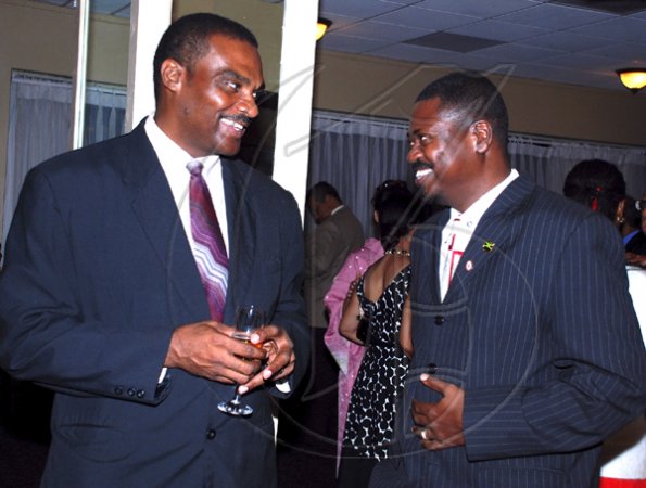 Colin Hamilton/Freelance Photographer
From left, Rory Alvaranga and Ian Andrews during the  Embassy of Japan hosted a reception in honour of the 76th birthday and 20th year of the reign of the Emperor Akhito at the Pegasus Hotel on December 9, 2009.
