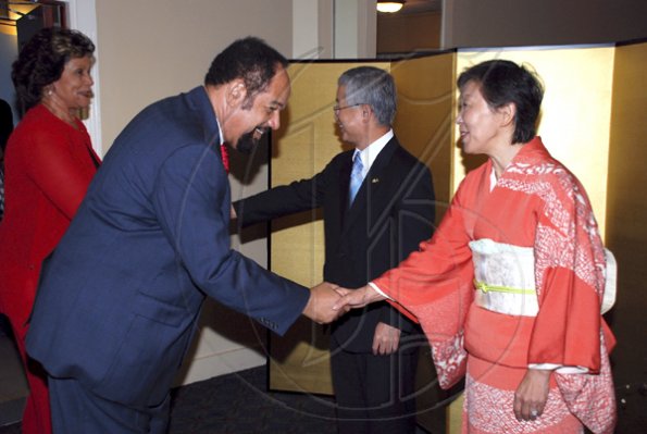 Colin Hamilton/Freelance Photographer
Senator Oswald harding is greeted by Mrs. Yoko Yamauchi, while Mrs Marigold Harding is greeted by Ambassador Hiroshi Yamaguchi during the Embassy of Japan hosted a reception in honour of the 76th birthday and 20th year of the reign of the Emperor Akhito at the Pegasus Hotel on December 9, 2009.