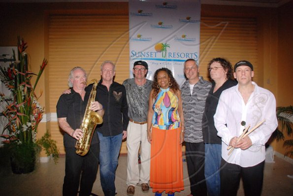 Contributed
Chief Operating Officer of Sunset Resorts, Craig Martin (third right), Jackie Edwards, convention services manager at Sunset Jamaica Grande (fourth left) with Roy Joe Jackson (third left) and members of his band after the Jamaica Jazz and Blues Prelude "Jamming in Sunset Jamaica Grande" on Monday night in Ocho Rios, St Ann.