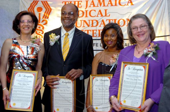 Rudolph Brown/Chief Photographer
Doctors Honoured by the Jamaica Medical Foundation from left Professor Kathleen Coard, Dr. Winston Dawes, Dr. Minerva Marcia Thame and Professor Denise Eldemire-Shearer, at the Jamaica Medical Foundation awards and fund-raising banquet at the Hilton Hotel in New Kingston on Saturday, March 21-2009