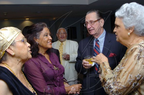 Rudolph Brown/Chief Photographer
R Danny Williams and his wife Shirley, (right) chat with Lois Sherwood, (left) , Sonia Lewis Brown, (second left) and Norman Heholt, (centre) at the Jamaica Medical Foundation awards and fund-raising banquet at the Hilton Hotel in New Kingston on Saturday, March 21-2009
