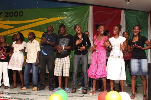 Anthony Minott/Freelance Photographer Bridgeport High School choir, fresh from their second place performance in Digicel's Altogether Sing competition, sing their hearts out during Woody's Restaurant/Transjamaica Highway  sponsored Portmore Mayor's Senior Citizens Christmas treat at the Portmore HEART Academy on Wednesday, December 22, 2010. Over 200 Senior Citizens were feted. Other sponsors include Sovereign Supermarket, TDK tours, and YP Seaton.