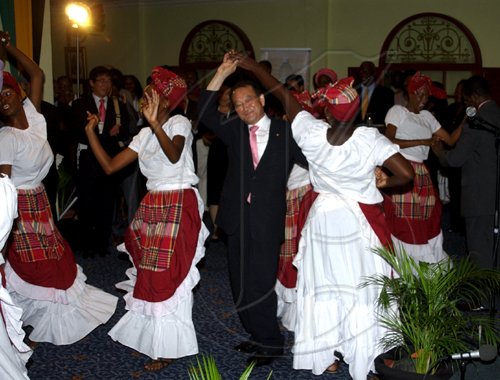 Winston Sill / Freelance Photographer
Mayor Desmond McKenzie host Welcome Reception for  delegates to the Intercity Intangible Cultural Cooperation Network (ICCN), Local Government International Conference, held at Knutsford Court Hotel on Monday September 14, 2009. Here members of the folk singing group Nexus take delegates to the damce floor.