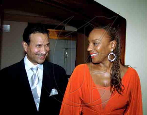 Winston Sill / Freelance Photographer
Exchanging glances:  A radiant Susan Taylor and her husband Kephra Burns  arrive for the Mico University Alumni Association (MOSA) biennial gold medal awards banquet.

****************************************************************************************, at the Jamaica Pegasus hotel, New Kingston on Saturday night April 17, 2010.