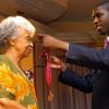 Peta-Gaye Clachar/Freelance Photographer
Senator Warren Newby representing the Minister of Youth, Sports and Culture Honourable Olivia Babsy Grange presents Mrs. Jean Smith with a silver medal for her contribution to Arts Administration at the Institute of Jamaica (IOJ) Musgrave Awards ceremony at IOJ on Wednesday, October 14, 2009.