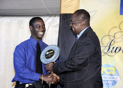 Winston Sill / Freelance PhotographerToyota Jamaica is number one! Howard Foster (left) accepts the NCB Auto Dealer of the Year award from Patrick Hylton, group managing director of the bank.**************************************************************National Commercial Bank (NCB) Auto Dealers Awards Ceremony, held at Terra Nova All-Suite Hotel, Waterloo Road on Tuesday night April 5, 2011.