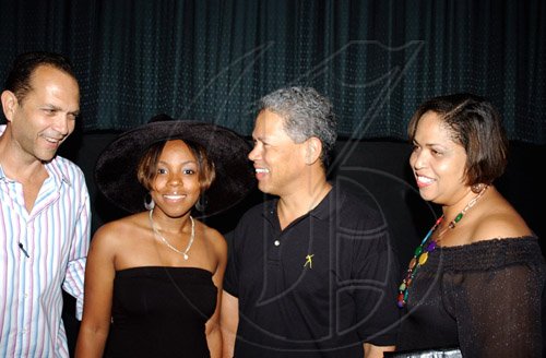 Winston Sill / Freelance Photographer
William Tavares-Finson (left) and president of Pan Caribbean, Donovan Perkins hangs out with Kimesha Bachelor (second left) and Frances Angus at the Pan  Caribbean pre-movie cocktail reception for the latest Harry Potter movie at Carib Cineplex, Cross Roads on Tuesday.

************************************************************************** July 21, 2009.