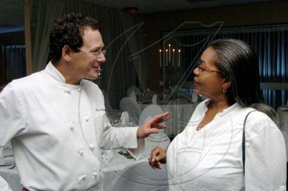 Winston Sill / Freelance Photographer
Compliments to the chef; The Jamaica Pegasus manager Nancy McLean listens attentively to Bruce Riezenman the man behind the fabulous gourmet seven-course gala dinner at the hotel last Friday.

***************************************************************************
Pegasus Hotel Food Festival "Fine Dining" Dinner, held at Pegasus Hotel, New Kingston on Friday November 6, 2009.
