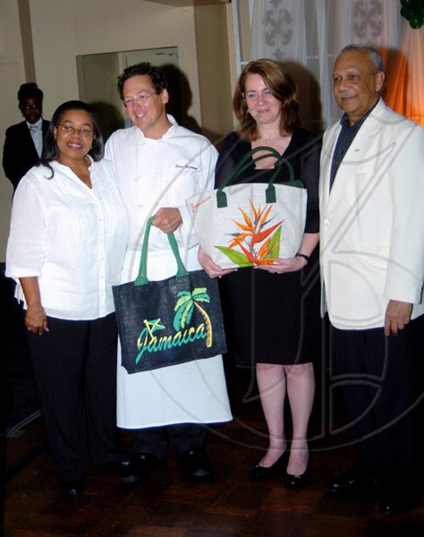 Winston Sill / Freelance Photographer
It was an evening with fine food and wines, so manager of the Jamaica Pegasus hotel Nancy McLean (left) and General Manager Eldon Bremner (right), presented the chef of the evening Bruce Riezenman (second left)  and wine expert Pascale Bres with gift bags to always remember their trip to the island.


,  
Pegasus Hotel Food Festival "Fine Dining" Dinner, held at Pegasus Hotel, New Kingston on Friday November 6, 2009.