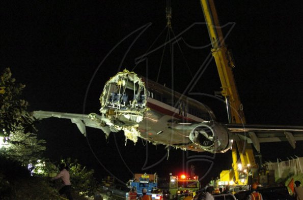 Winston Sill / Freelance Photographer
Removal of crash American Airlines aircraft from the crash site, off Port Royal Road, on Monday night December 28, 2009. Winston Sill / Freelance Photographer
Removal of the middle section of the  crashed  American Airlines aircraft from the crash site, off Port Royal Road, on Monday night December 28, 2009.