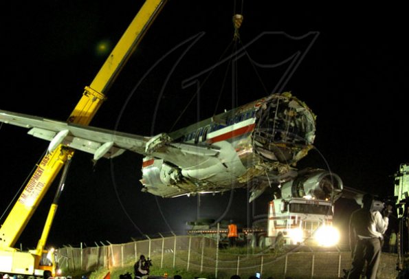 Winston Sill / Freelance Photographer
Removal of crash American Airlines aircraft from the crash site, off Port Royal Road, on Monday night December 28, 2009. Winston Sill / Freelance Photographer
Removal of the middle section of the  crashed  American Airlines aircraft from the crash site, off Port Royal Road, on Monday night December 28, 2009.