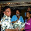 Winston Sill / Freelance Photographer
Lasco boss Lascelles Chin (left) was a little surprised to receive a birthday present at the party from (from second left) Jean Lowrie-Chin, her daughter Anita and hubbie Hubie.
PRO Comm Christmas Party, held at Kingsway on Saturday night December 5, 2009.