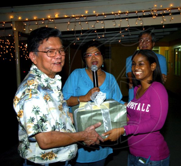 Winston Sill / Freelance Photographer
Lasco boss Lascelles Chin (left) was a little surprised to receive a birthday present at the party from (from second left) Jean Lowrie-Chin, her daughter Anita and hubbie Hubie.
PRO Comm Christmas Party, held at Kingsway on Saturday night December 5, 2009.