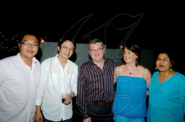 Winston Sill / Freelance Photographer
Everyone wanted a photo with Jean Lowrie-Chin (right) of PROComm fame and (from left) Dr Tony Zeng, Eric Zhang, Colm and Delves join in.
 Christmas Party, held at Kingsway on Saturday night December 5, 2009.