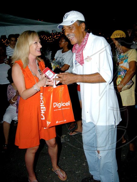 Winston Sill / Freelance Photographer
D'Arcey Crooks gets his prize from Digicel's Antonia Graham.

PRO Comm Christmas Party, held at Kingsway on Saturday night December 5, 2009.