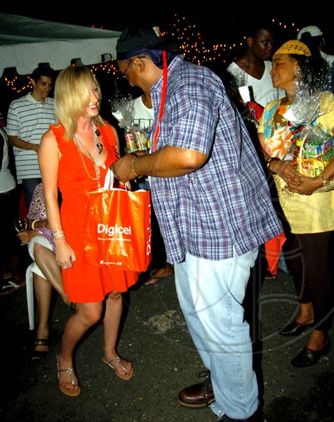 Winston Sill / Freelance Photographer
Digicel's Antonia Graham presents Brian St Juste with a prize for looking very 'yardy'.
PRO Comm Christmas Party, held at Kingsway on Saturday night December 5, 2009.