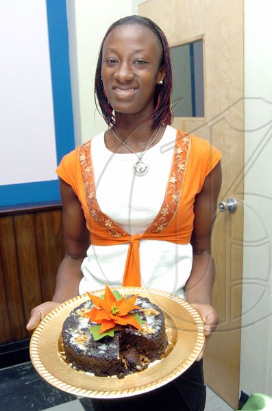 Peta-Gaye Clachar/Freelance Photographer
Stephanny Richards with her third place winning cake.

******************************************************************************RL Christmas Cake contest at the Gleaner on Friday, December 11, 2009.