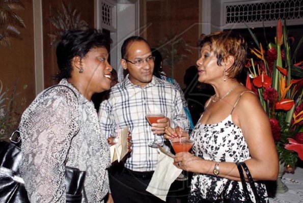 Colin Hamilton/Freelance Photographer
From left, Lisa Bell; Peter William and Faye Jacobs, catch up on the latest happenings.

************************************************************ during the
Restaurant Week launch at Devon House on Thursday October 1, 2009.