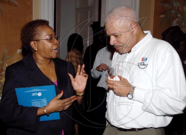Colin Hamilton/Freelance Photographer
The Gleaner's Karin Cooper,  manager business development and marketing chats with ATL's John Walter.

*************************************************************************** during the Restaurant Week launch at Devon House on Thursday October 1, 2009.
