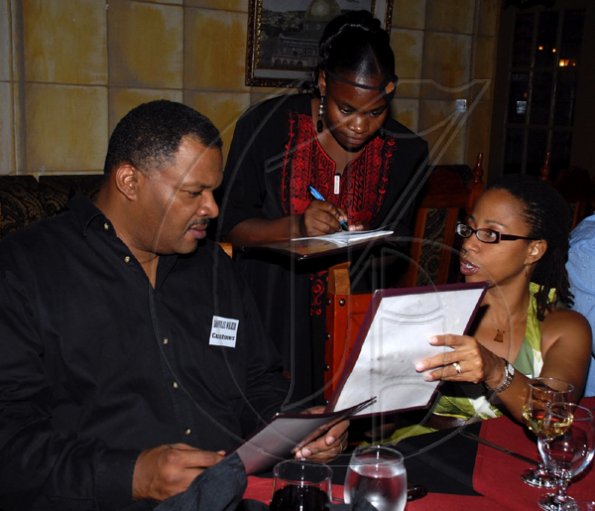 Colin Hamilton/freelance photographer
Nidia DaSilva, centre takes an order from Danville and Sharon Walker at Latino Habibi during Restaurant Week at the Marketplace Food Court on Wednesday November 11, 2009.