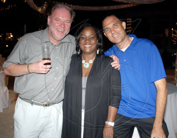 Janet Silvera
From left, German Consular and deputy head of mission, Michael Kroner, poses for the camera with RIU's director of sales, Angella Bennett and Caribic Vacation's Oliver Townsend at a beach party at RIU Ocho Rios last for some 100 media practicioners that were on the island for the TUI educational summer programme.