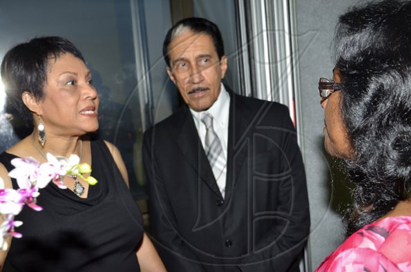 Rudolph Brown/Photographer
Jackie McGregor (right), of the Rotary Club of Downtown Kingston, has the attention of past president Dr Robert Parchment and his wife, Patricia. The occasion was the Rotary Club of St Andrew North's 25th annual installation ceremony at the Wyndham Hotel in New Kingston on Monday, June 27, 2011.
