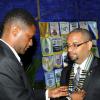 Rudolph Brown/Photographer
Outgoing president Donovan Brown (left), adjusts the collar on newly-installed president David T. Brown at the Rotary Club of St Andrew North Installation ceremony at RibKage, St Andrew on Monday, June 28, 2010.