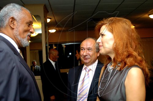 Winston Sill / Freelance Photographer
Ambassador Douglas Saunders (left) chats with Rusal's Igor Dorofeev and his wife Elena Dorofeev.

***********************************************************************
Russian Ambassador host Reception to celebrate the 35th Anniversary of Diplomatic Ties between Jamaica and Russia, held at the Jamaica Pegasus Hotel, New Kingston on Tuesday March 16, 2010.