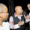 Rudolph Brown/Photographer
Mark Chisholm, (centre) vice president, Individual Life Sales, Sagicor chat with Willard Brown, (left) and Albert Lyon at the Sagicor christmas party at the Office car park in New Kingston on Saturday, December 12-2009
