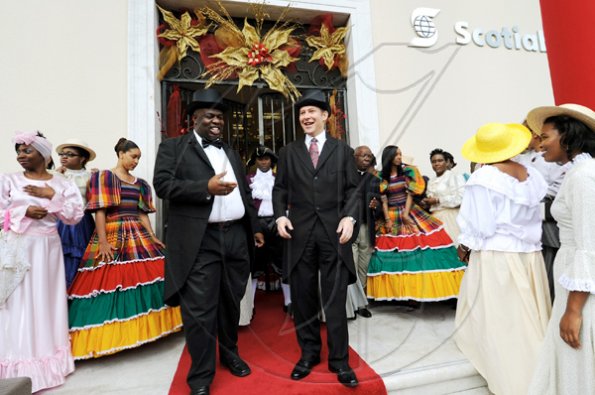 Rudolph Brown/Photographer
LEAD PICTURE

Bruce Bowen (right), president and chief executive officer, Scotiabank Group Jamaica, chats with Michael Shaw (left), Scotiabank King Street branch manager before the official opening of the bank, to mark the bank's  celebrationg 120 years in Jamaica from 1889 to 2009 at the branch on Monday, December 14.

******************************************************************-2009