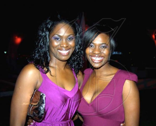 Winston Sill / Freelance Photographer
Josette (left) and Kashina Dawkins absolutely glow at the Shaggy Foundation's Shaggy and Friends 2010  Concert, held on the lawns of Jamaica House, Hope Road on Saturday night.




 January 2, 2010.