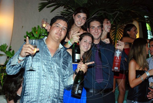 Janet Silvera 
From L- If any group celebrated New Year's in fine style it was Mark Myers, Jaime Bicknell, Peter Issa and Jaime Mahfood (top) at Blue Beat's fabulous 'Soiree Bourgeoise' 18th century French themed New Year's Eve party last Thursday night in Montego Bay.