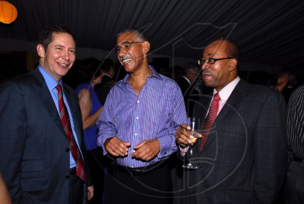 Colin Hamilton/Freelance Photographer
From left, Scotiabank's Bruce Bowen hangs out with Mark Mckenzie and Dr Wesley Hughes during the Spanish National Day reception at the Spanish Ambassador's residence on Tuesday October 13, 2009.
