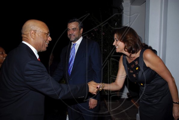 Colin Hamilton/freelance photographer
Governor General The Hon. Sir Patrick Allen is greeted on arrival by the Ambassador's wife Sara,  Ambassador DeSilva?looks on during the Spanish National Day reception at the Spanish Ambassador's residence on Tuesday October 13, 2009.