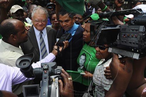 Ian Allen/Staff Photographer
Micheal Stern and Karl Samuda talk with members of the Media after a Judge ruled that a Bi-election should be held in the North West Clarendon Constituency.