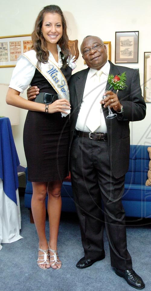 Peta-Gaye Clachar/Freelance Photographer
Gleaner driver Leopold Swaby is in seventh heaven beside  Kerrie Baylis, Miss Jamaica World. Swaby has served the company for 10 years and Baylis was special guest at the Long Service Awards luncheon.

**********************************************************************************************at the Gleaner's North Street Office on Monday, September 21, 2009.