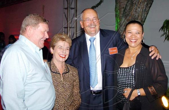 Winston Sill / Freelance Photographer
Nice to see competitors not at each other's throats (unlike our DJs). Here Stewart Motors' Richard (left) and Diana Stewart (second left) get a share of the limelight with Toyota Jamaica boss John Connell and his wife Ren at the launch of the new Land Cruiser Prado at Devon House on Thursday.