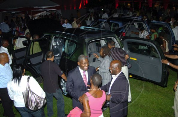 Winston Sill / Freelance Photographer
Guests swarm the new Toyota Land Cruiser Prado at their unveiling at Devon House on Thursday.

Jamaica launches new Prado.